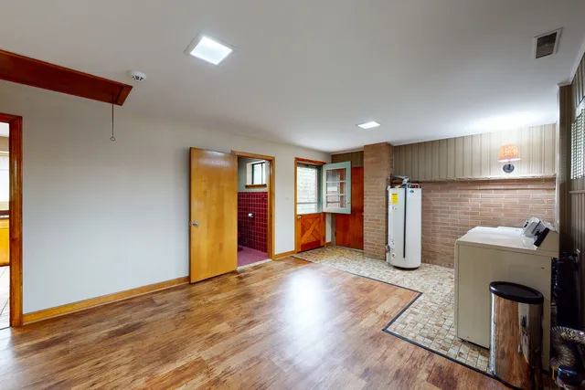 a view of a storage & utility room with a window