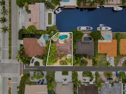 an aerial view of a house with outdoor space