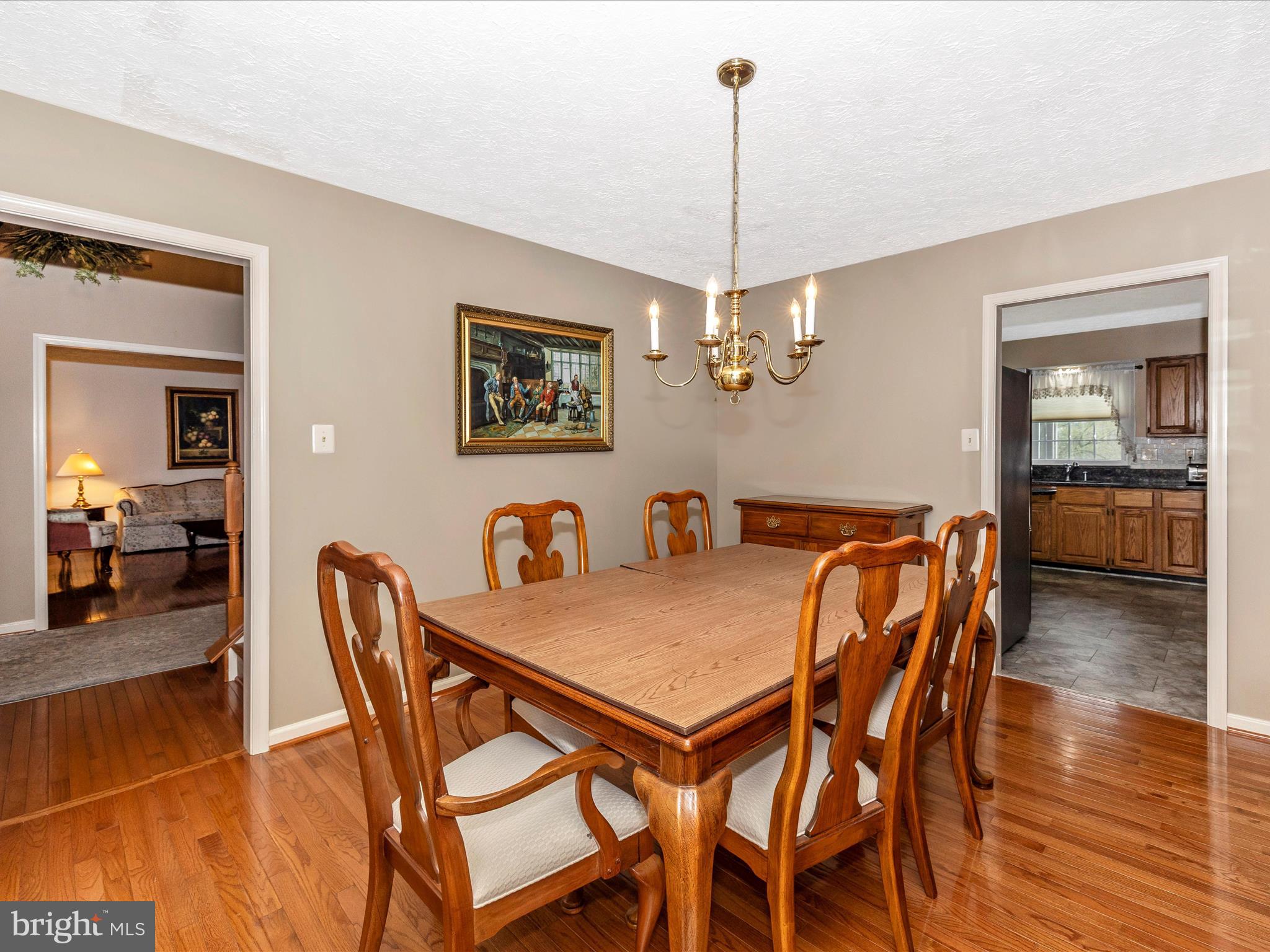 10 Knoll Side Lane Middletown, MD 21769 - Photo 13 of 84 a view of a dining room and livingroom with furniture wooden floor a chandelier