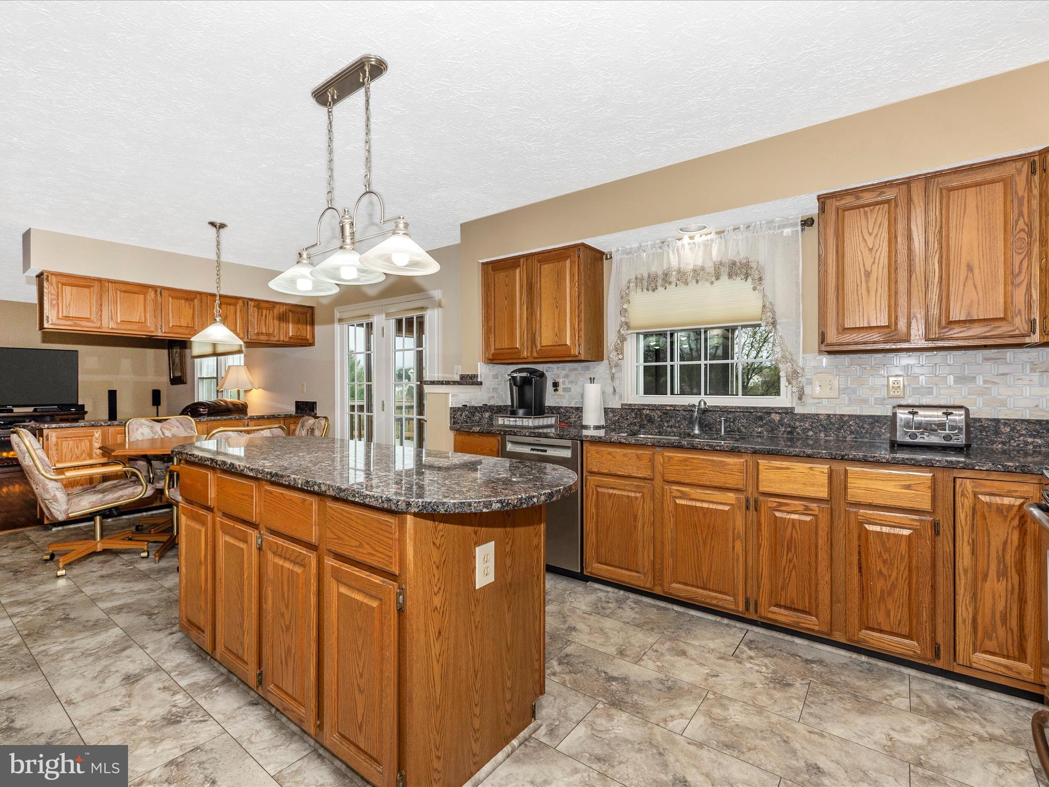 10 Knoll Side Lane Middletown, MD 21769 - Photo 17 of 84 a kitchen with stainless steel appliances granite countertop a sink counter space cabinets and a window
