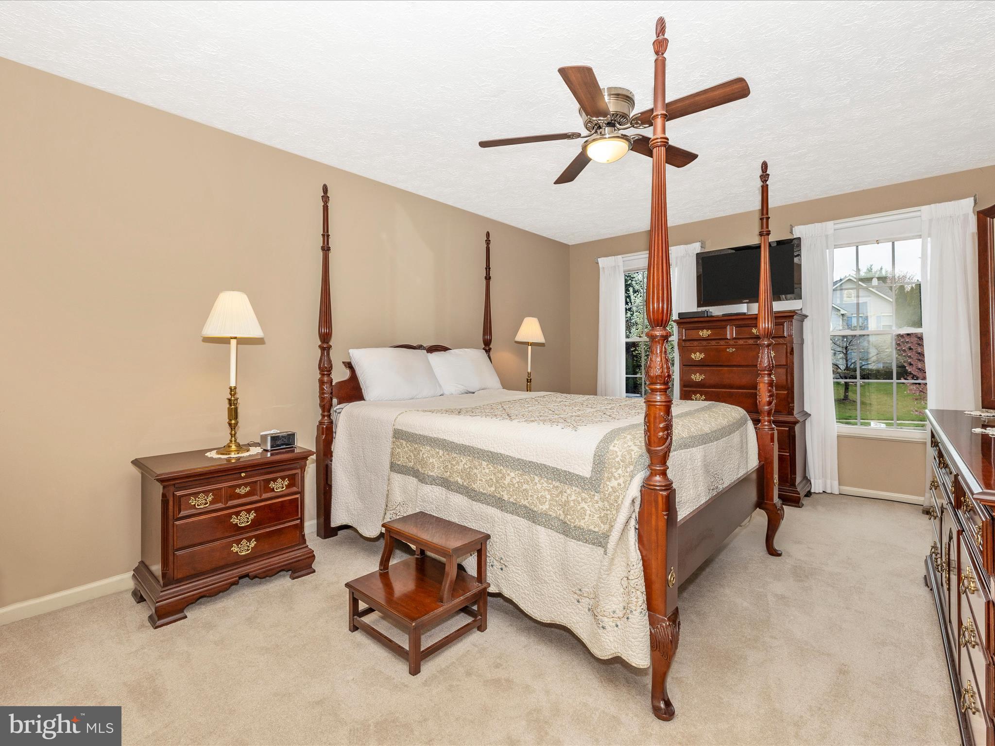10 Knoll Side Lane Middletown, MD 21769 - Photo 25 of 84 a bedroom with a bed and a chandelier