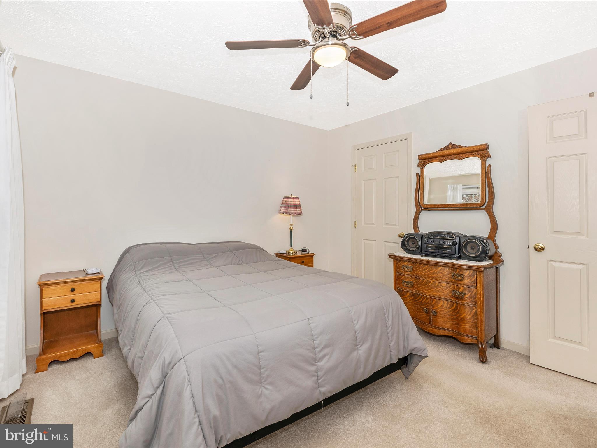 10 Knoll Side Lane Middletown, MD 21769 - Photo 32 of 84 a bedroom with a bed and a chandelier fan