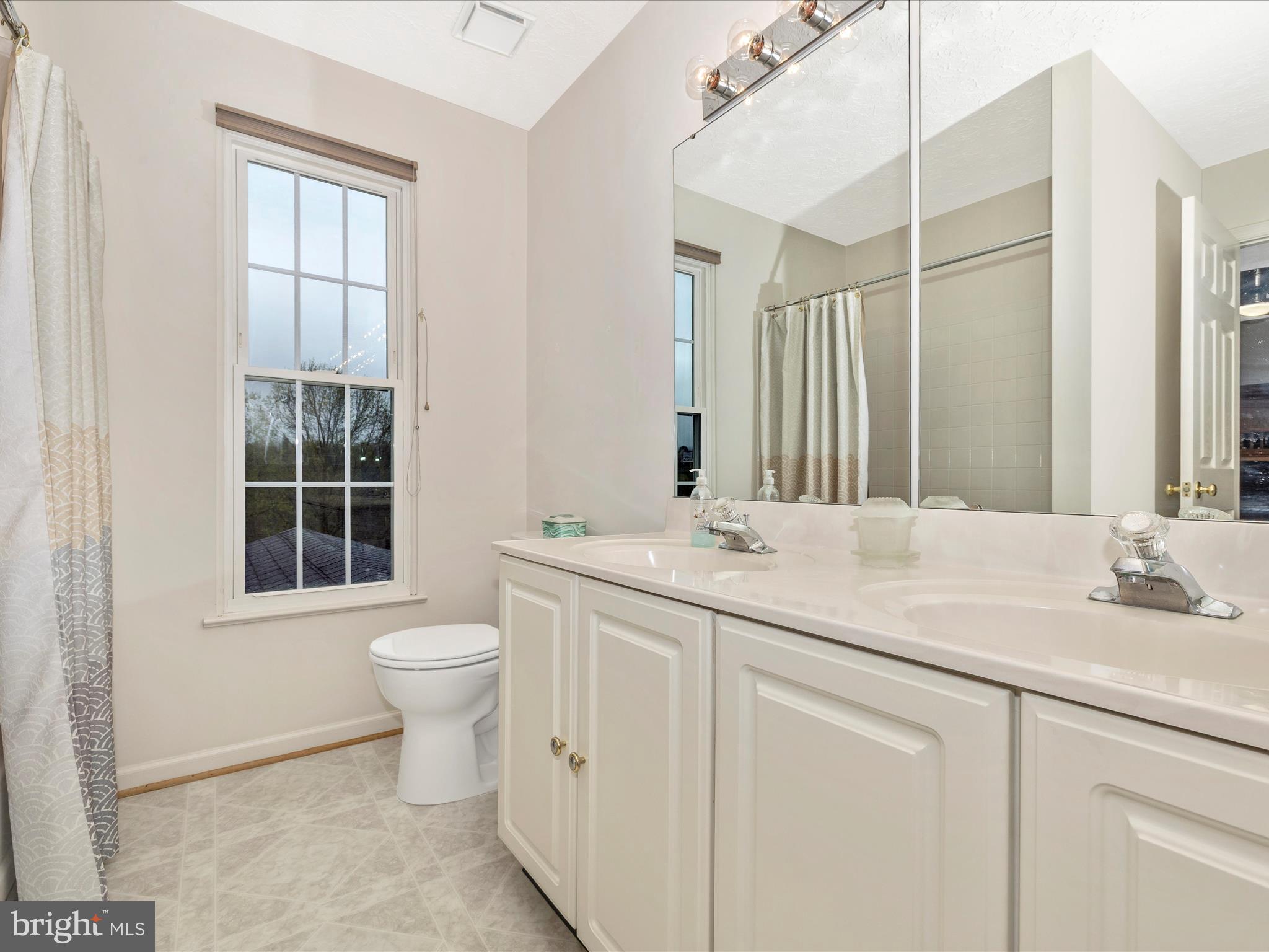 10 Knoll Side Lane Middletown, MD 21769 - Photo 35 of 84 a bathroom with a toilet sink and mirror