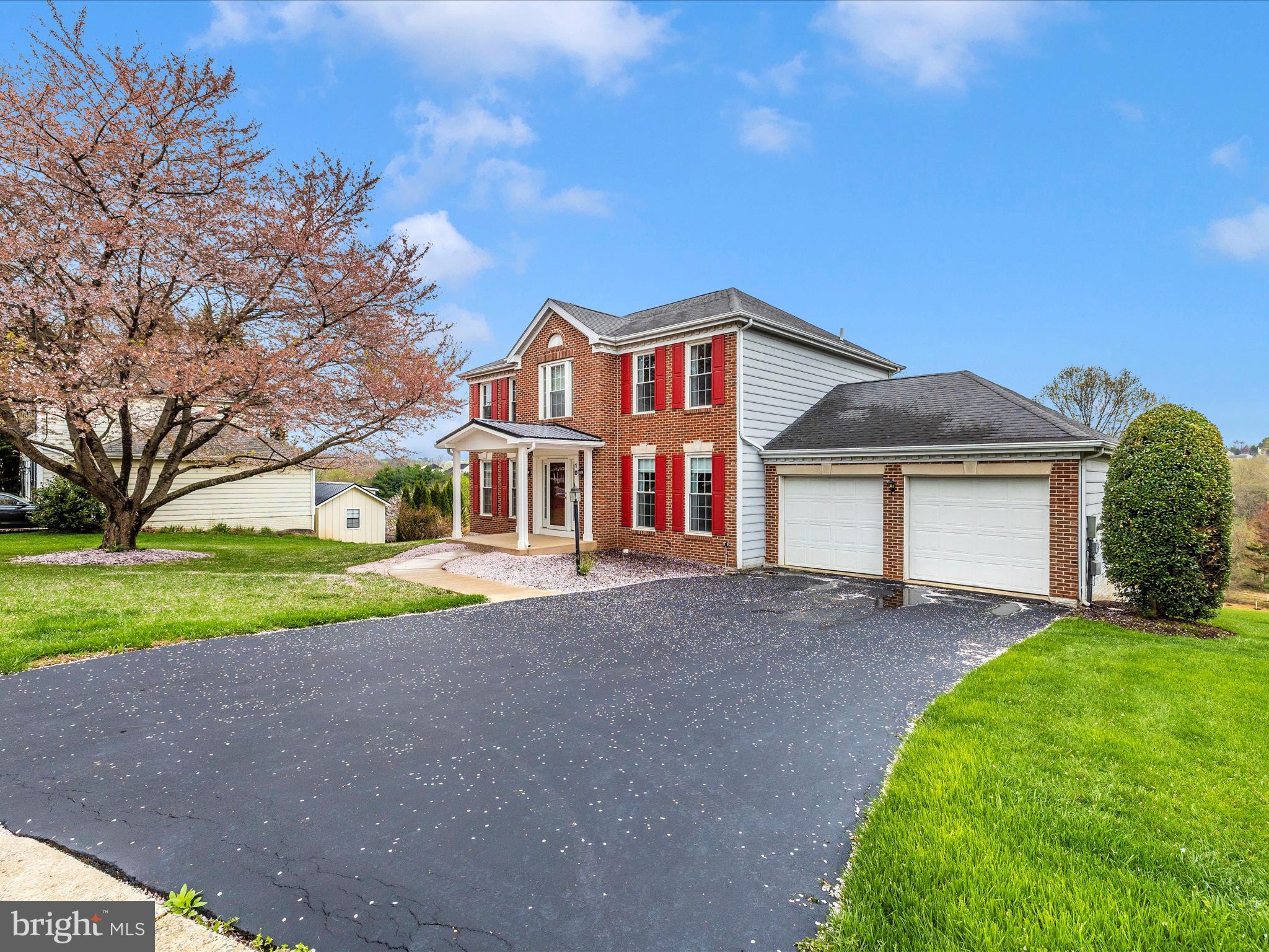 10 Knoll Side Lane Middletown, MD 21769 - Photo 46 of 84 a front view of a house with a yard and garage