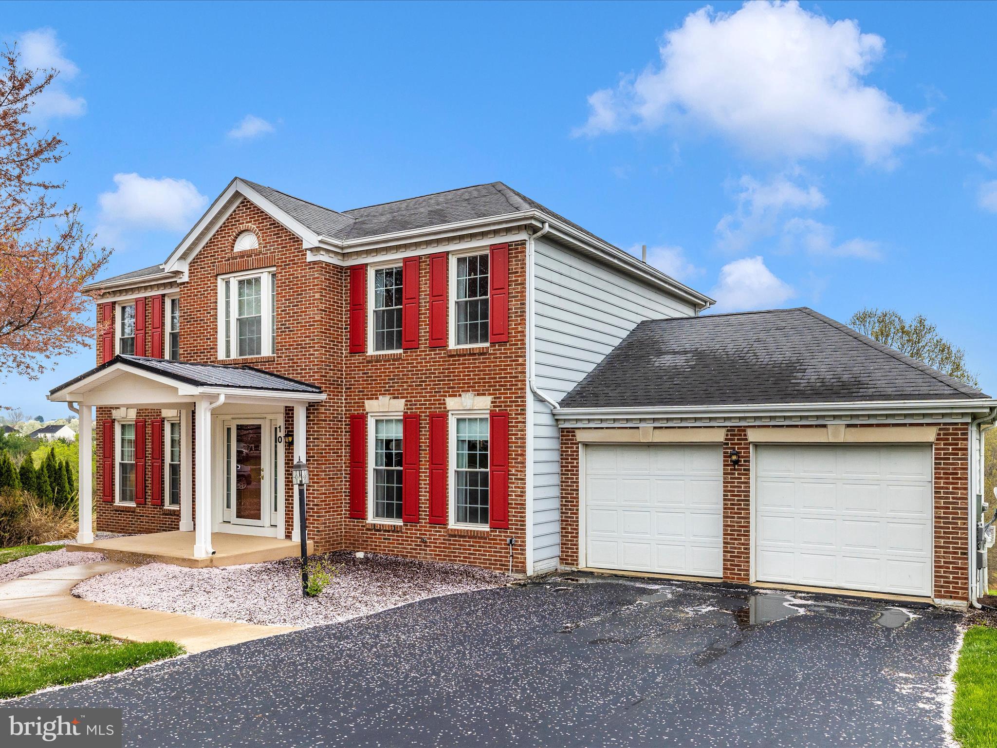 10 Knoll Side Lane Middletown, MD 21769 - Photo 47 of 84 a front view of a house with a yard and garage