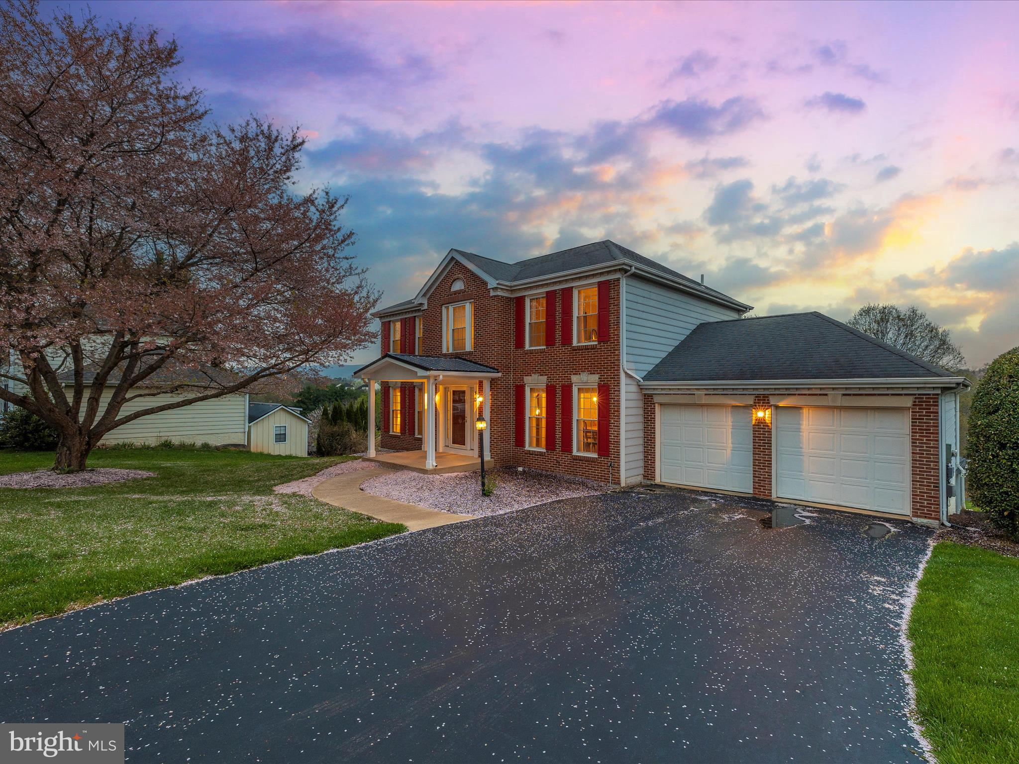 10 Knoll Side Lane Middletown, MD 21769 - Photo 62 of 84 a front view of a house with a yard and garage