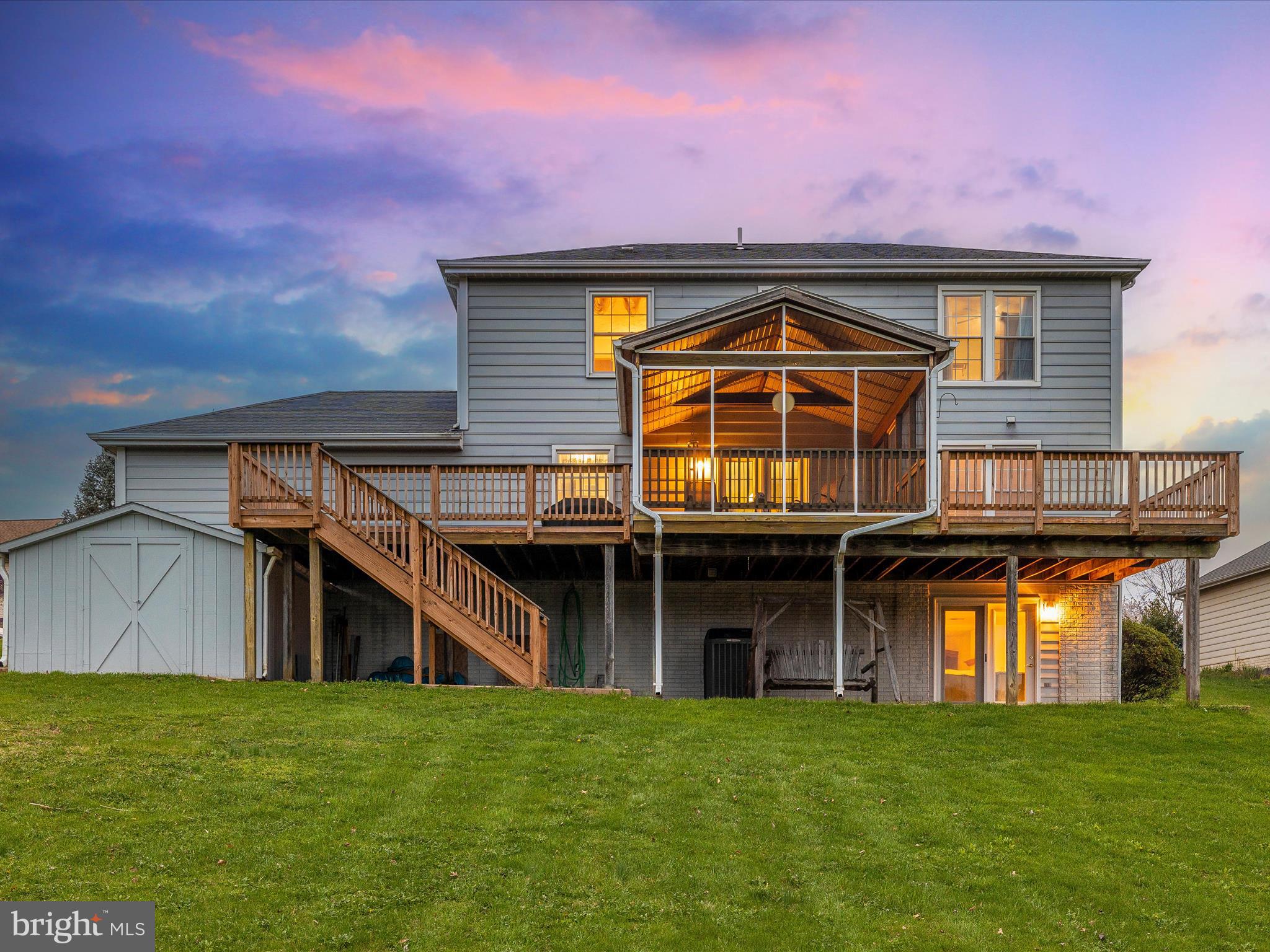 10 Knoll Side Lane Middletown, MD 21769 - Photo 64 of 84 a front view of a house with a garden and deck