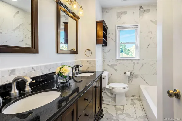 a view of room with window and wooden floor