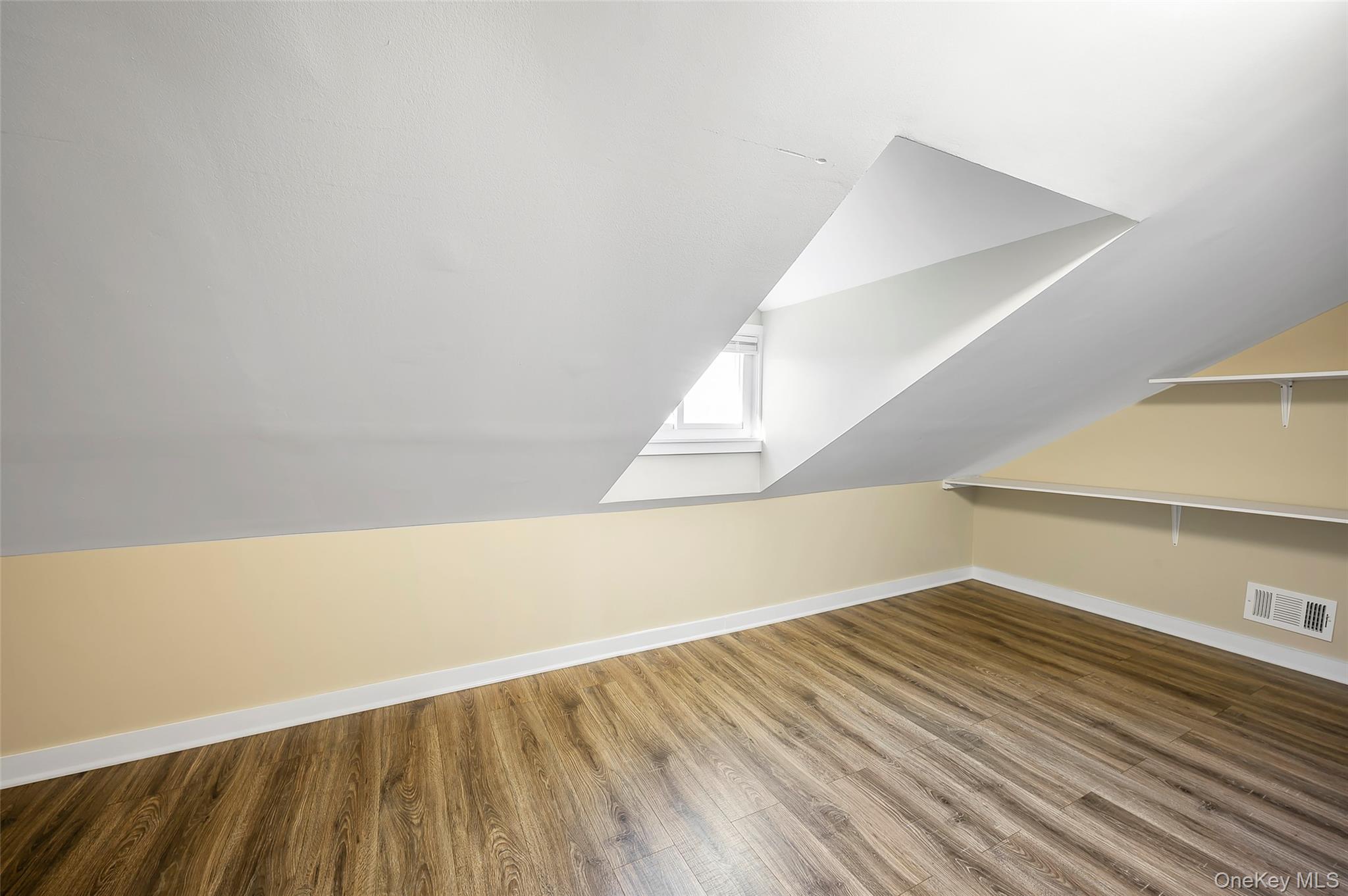 9 Todd Place, Unit 2ND FL RIGHT SIDE Ossining, NY 10562 - Photo 17 of 20 Additional living space with wood finished floors and lofted ceiling