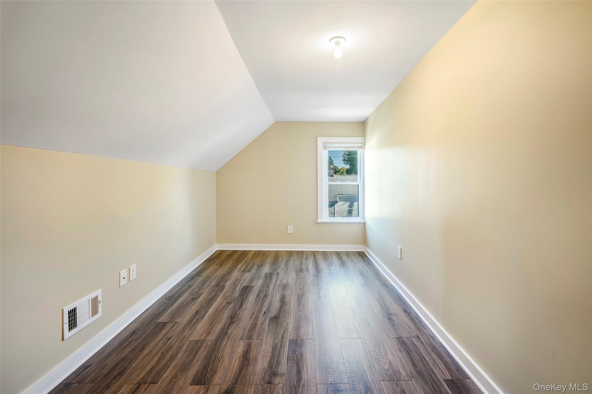 9 Todd Place, Unit 2ND FL RIGHT SIDE Ossining, NY 10562 - Photo 18 of 20 Bonus room featuring vaulted ceiling and dark wood-type flooring