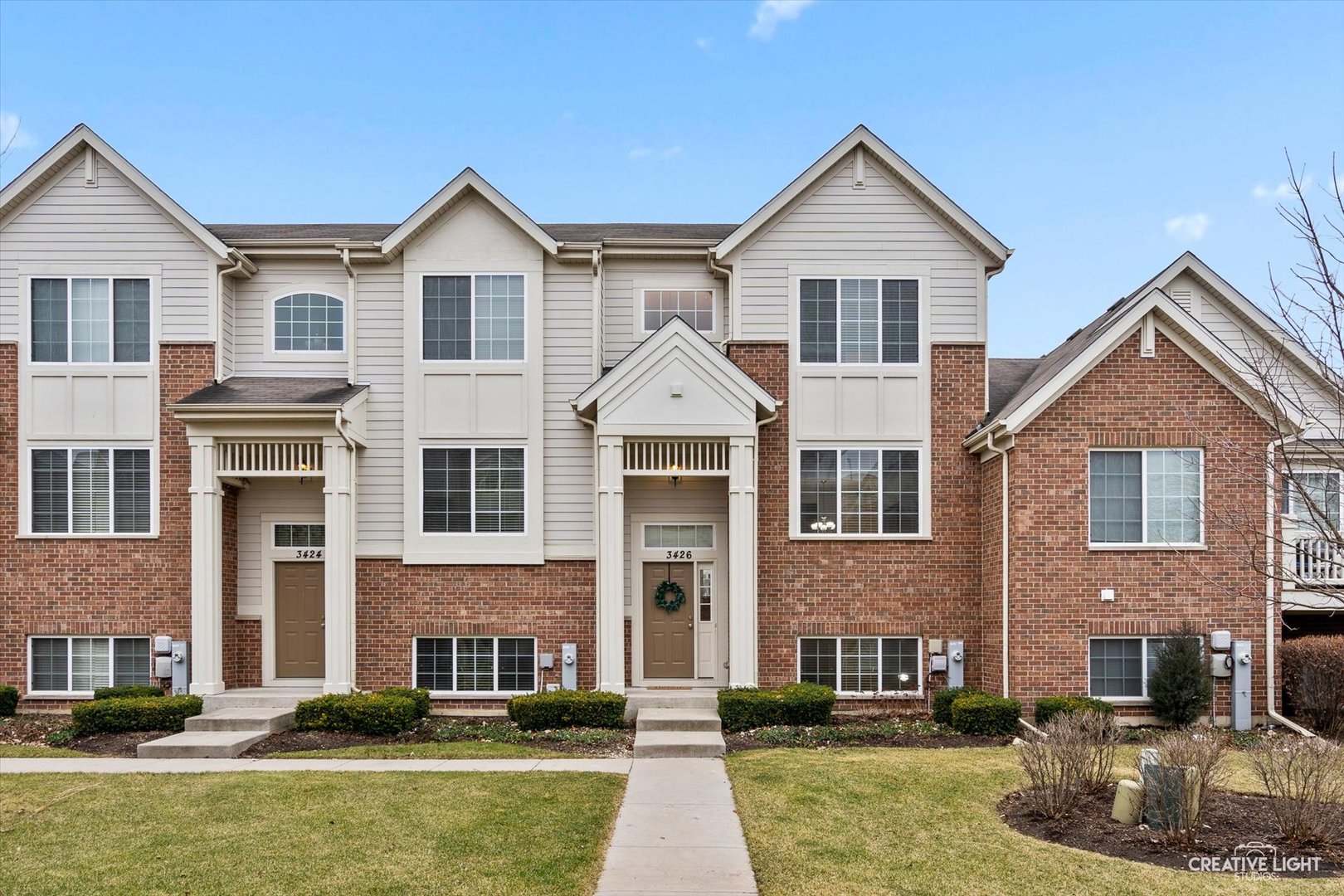 3426 Cameron Drive, Unit 3426 Elgin, IL 60124 - Photo 1 of 17 a front view of a house with a yard