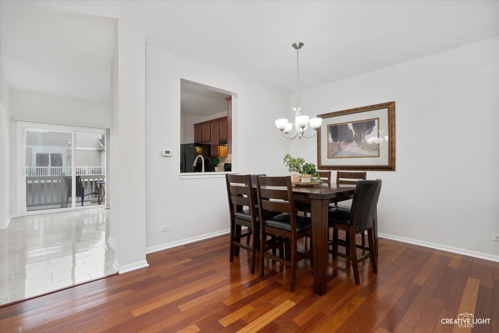 3426 Cameron Drive, Unit 3426 Elgin, IL 60124 - Photo 4 of 17 a view of a dining room with furniture and wooden floor