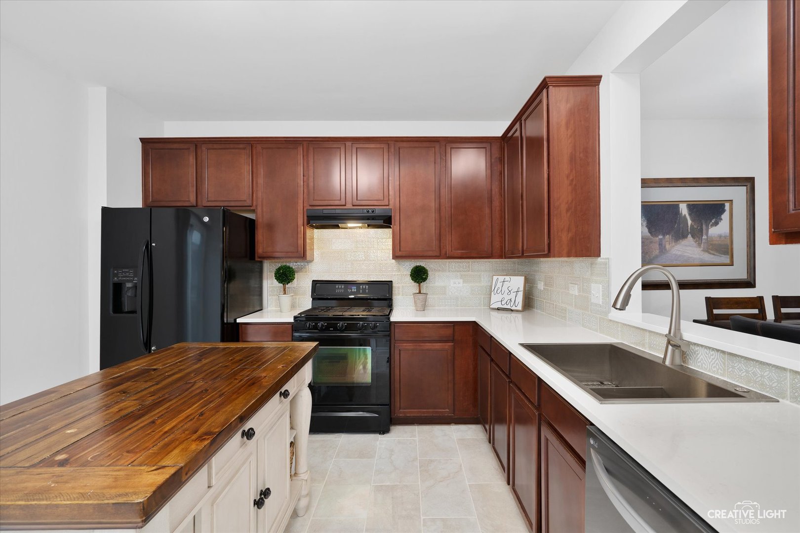 3426 Cameron Drive, Unit 3426 Elgin, IL 60124 - Photo 6 of 17 a kitchen with stainless steel appliances granite countertop a sink stove and refrigerator
