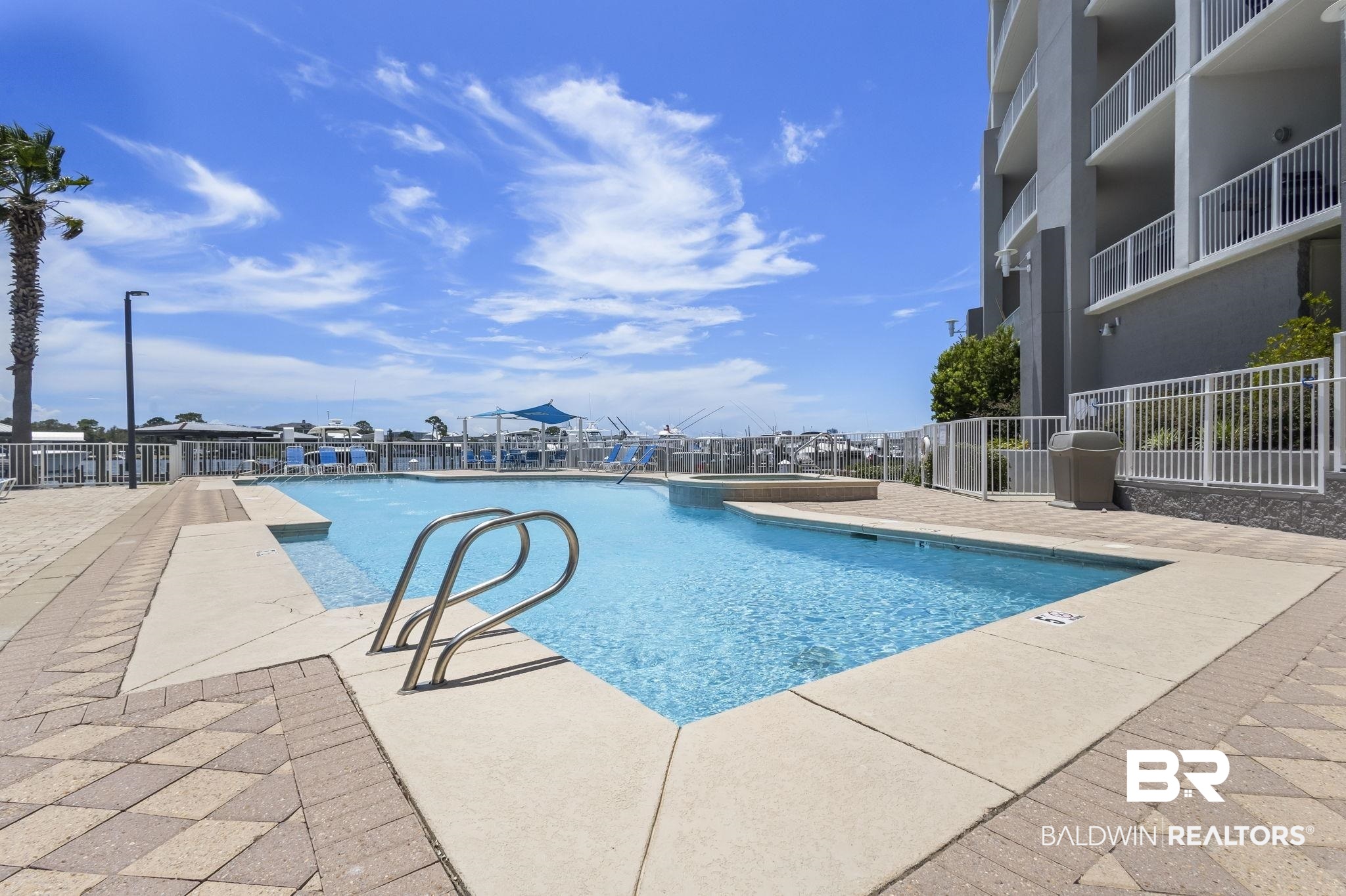 28250 Canal Road, Unit 403 Orange Beach, AL 36561 - Photo 9 of 54 View of swimming pool with a patio and a pool with connected hot tub
