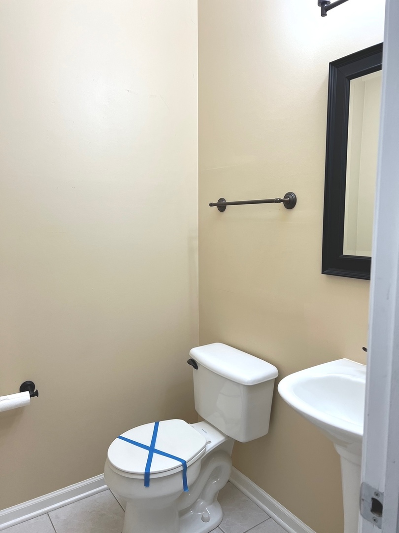 2966 White Thorn Circle Naperville, IL 60564 - Photo 7 of 14 a white toilet sitting next to a bathroom sink