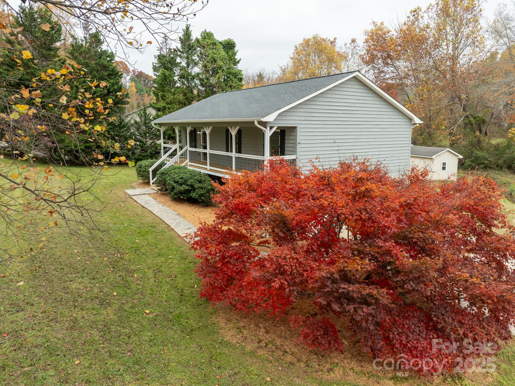 2830 Ellerwood Road Hudson, NC 28638 - Photo 14 of 46 a view of a house with backyard and garden