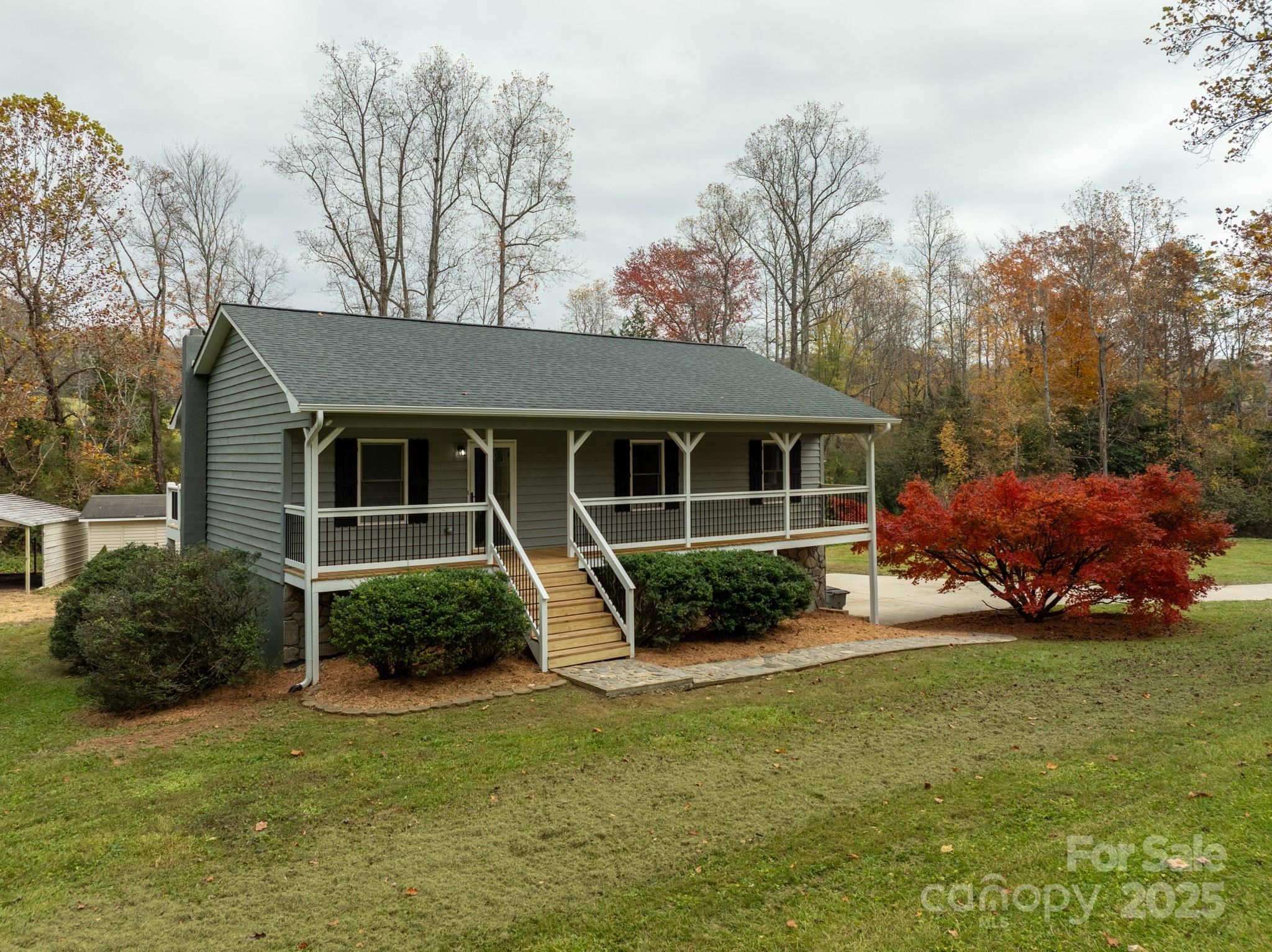 2830 Ellerwood Road Hudson, NC 28638 - Photo 17 of 46 a view of a house with sitting area and garden