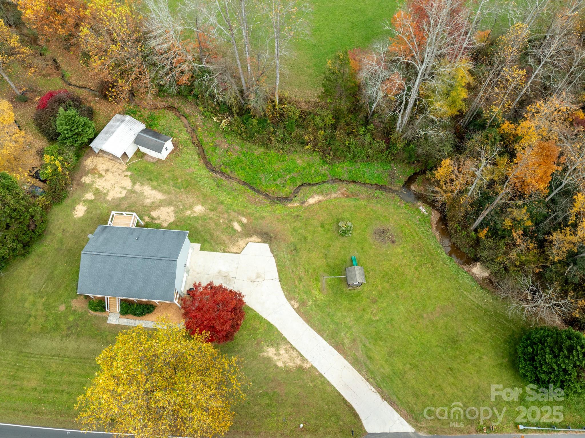 2830 Ellerwood Road Hudson, NC 28638 - Photo 2 of 46 a view of a swimming pool with a yard