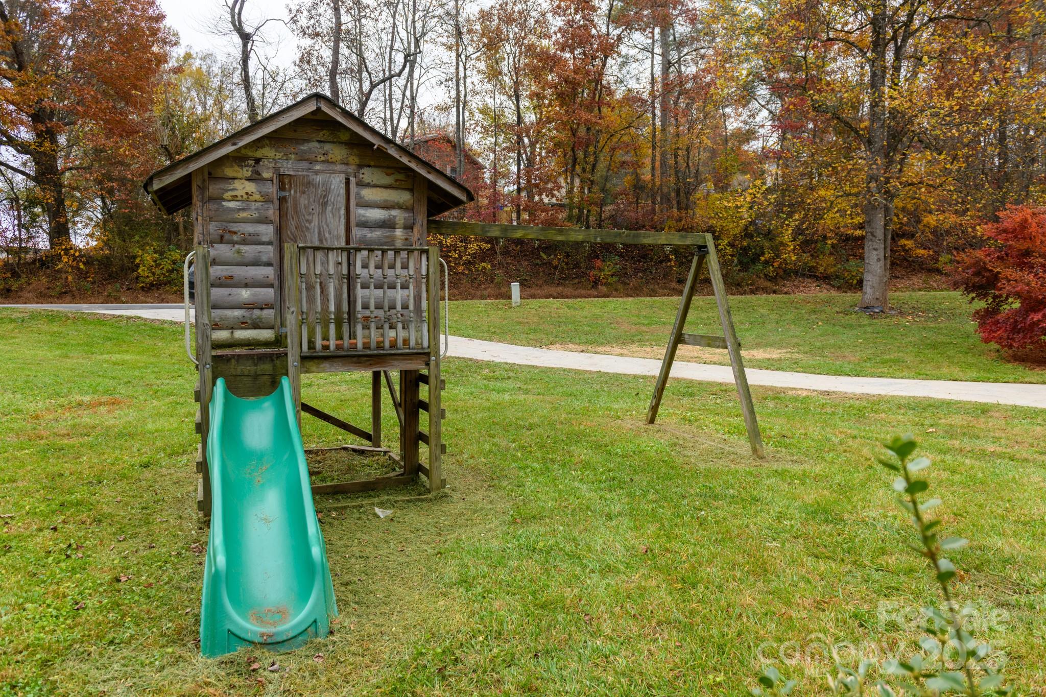 2830 Ellerwood Road Hudson, NC 28638 - Photo 23 of 46 a view of a bench in the garden near a lake