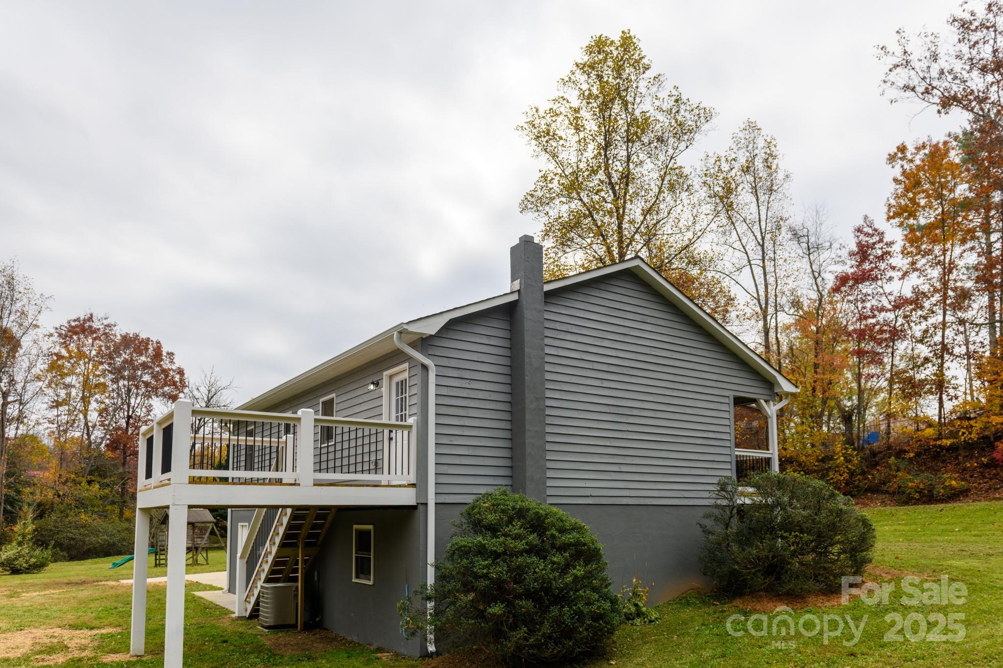 2830 Ellerwood Road Hudson, NC 28638 - Photo 24 of 46 a view of backyard with small garden and outdoor seating