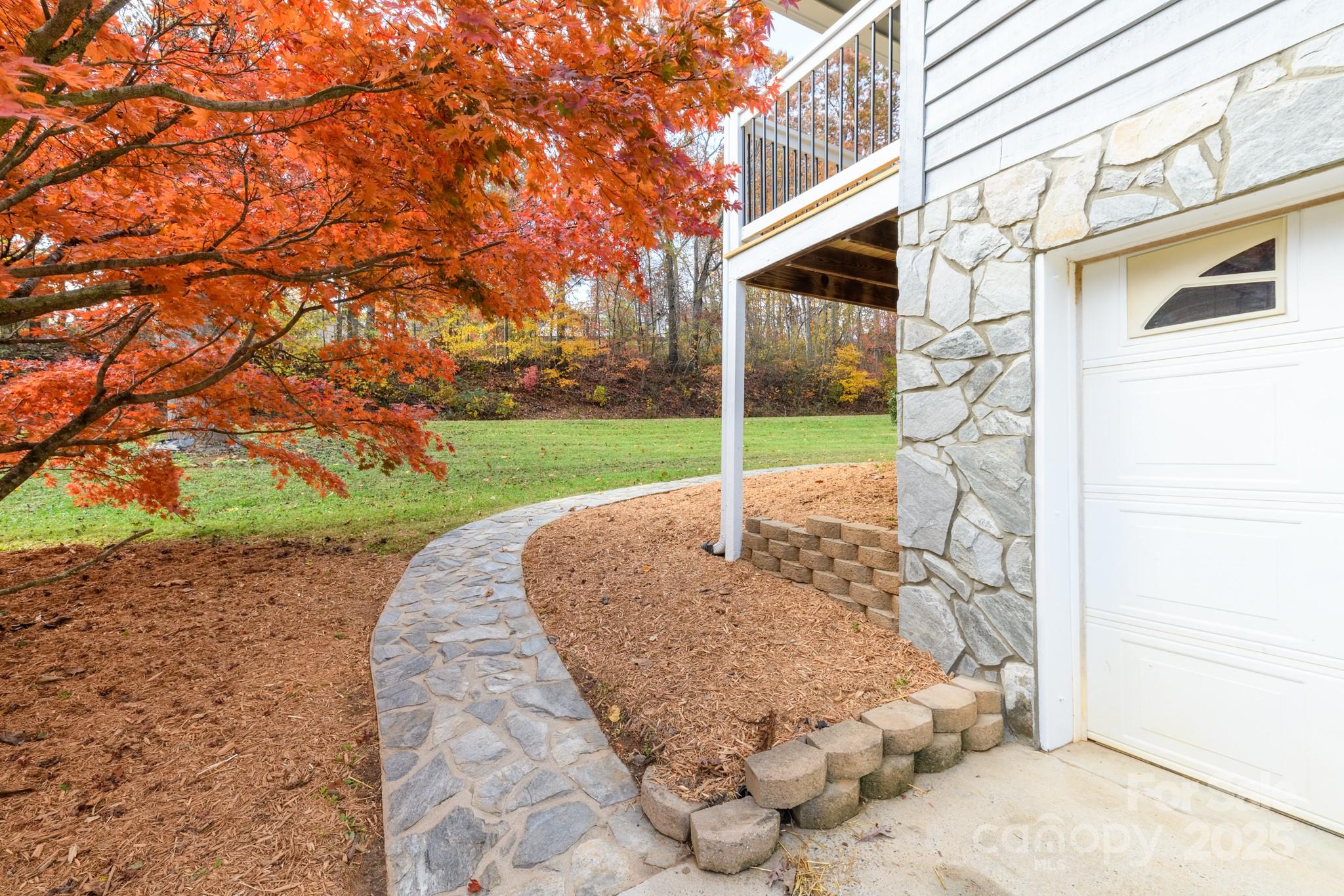 2830 Ellerwood Road Hudson, NC 28638 - Photo 26 of 46 a backyard of a house with lots of green space