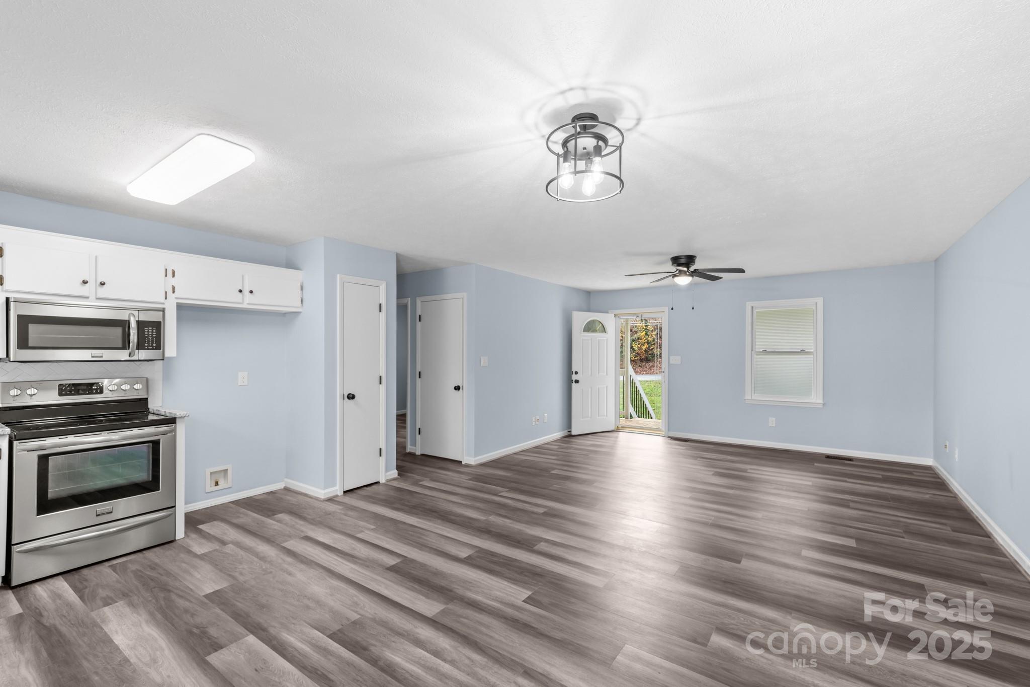 2830 Ellerwood Road Hudson, NC 28638 - Photo 33 of 46 a view of an empty room with a window and kitchen area