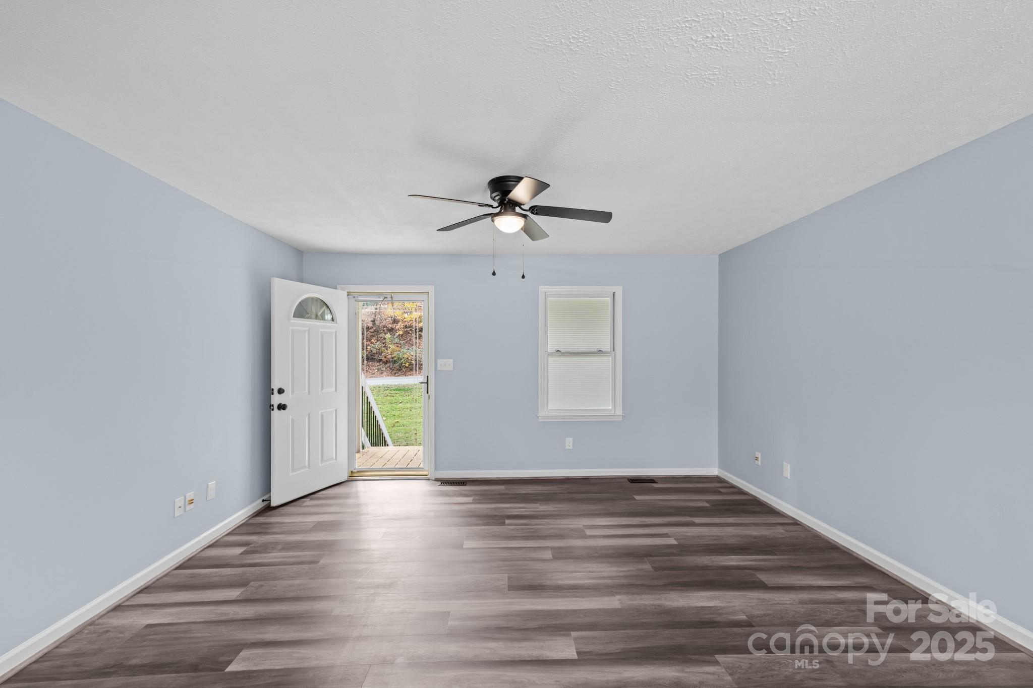 2830 Ellerwood Road Hudson, NC 28638 - Photo 34 of 46 a view of an empty room with wooden floor and a window