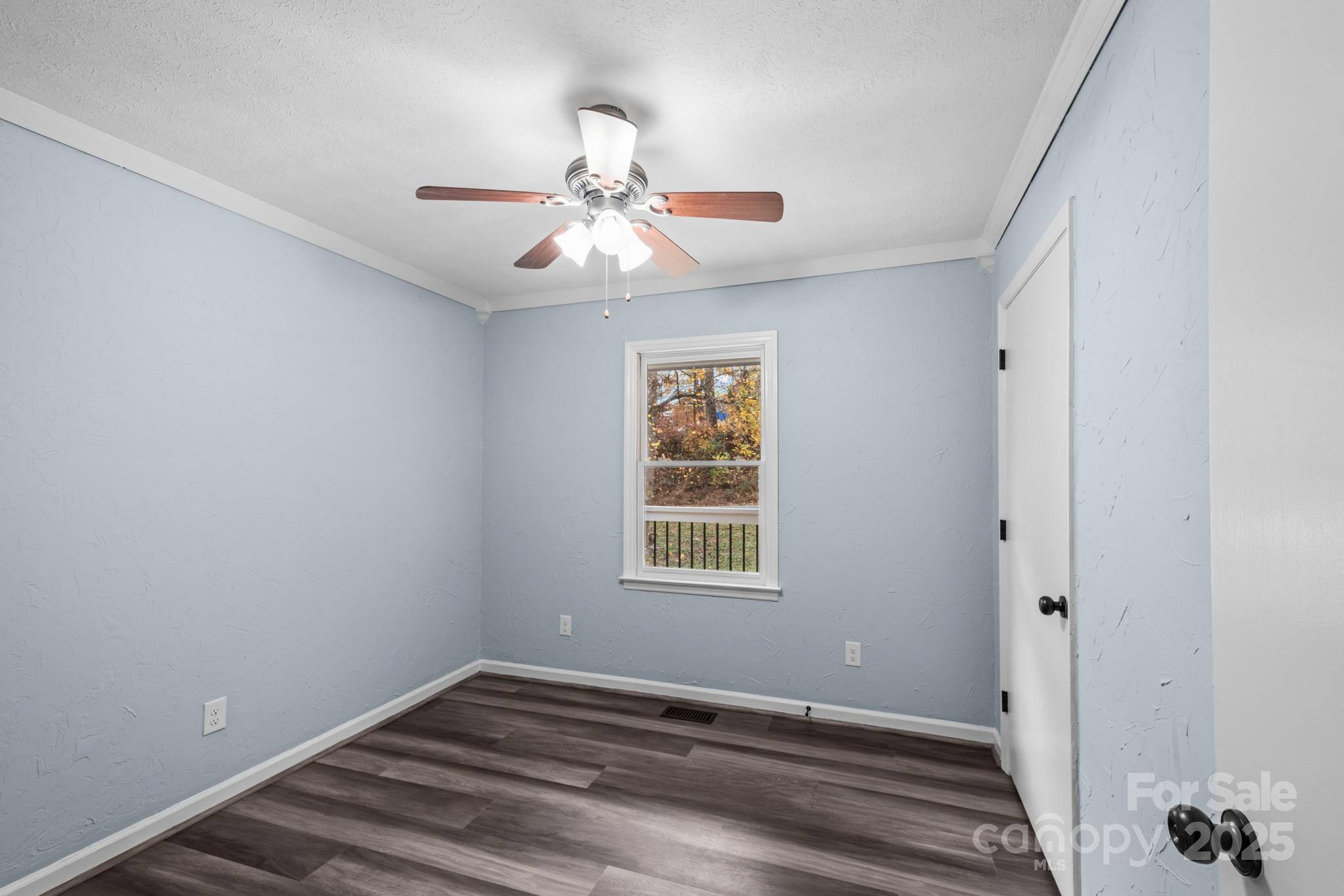 2830 Ellerwood Road Hudson, NC 28638 - Photo 38 of 46 a view of an empty room with wooden floor and a window