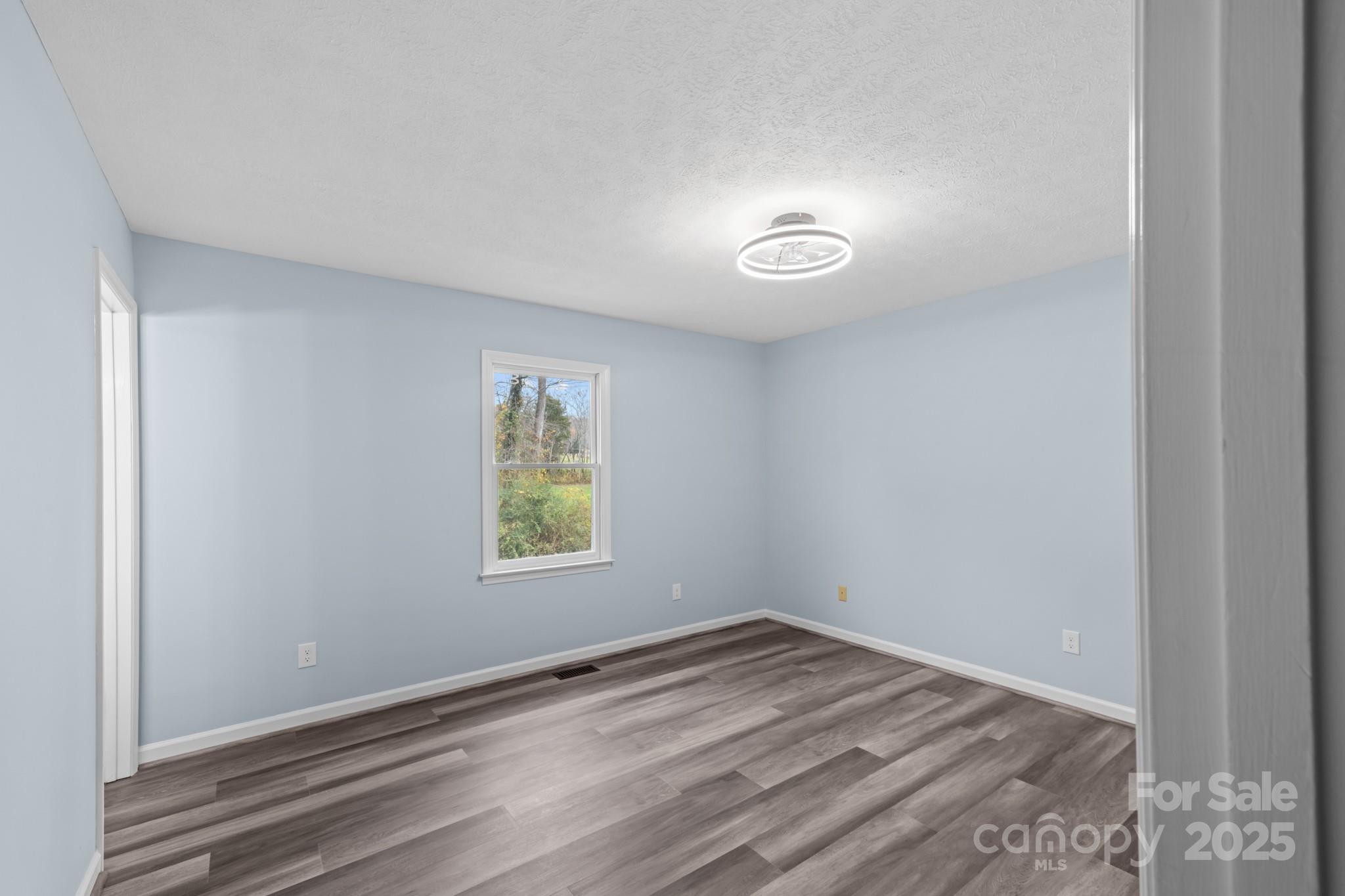 2830 Ellerwood Road Hudson, NC 28638 - Photo 39 of 46 an empty room with a window