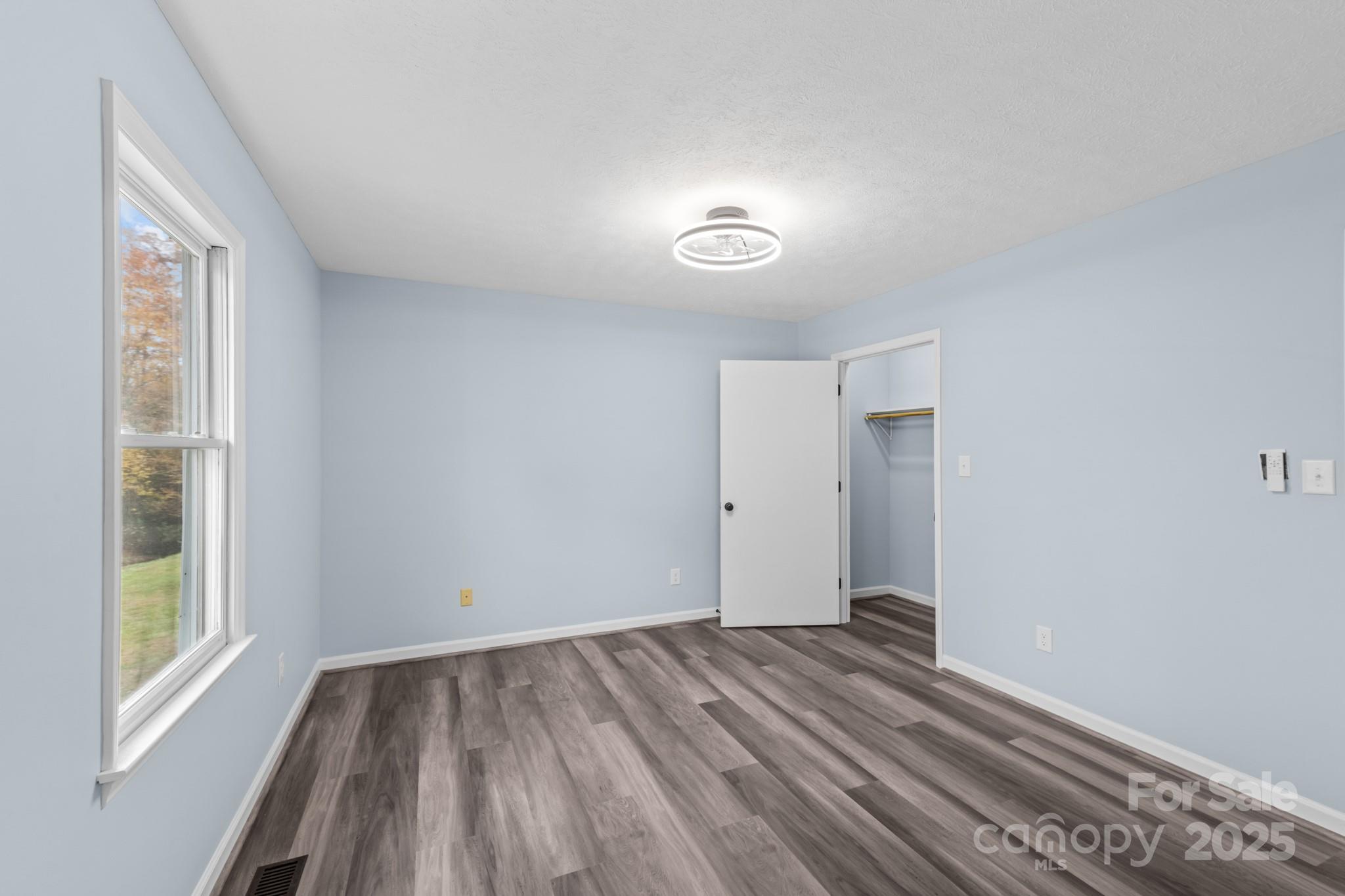 2830 Ellerwood Road Hudson, NC 28638 - Photo 40 of 46 a view of an empty room with wooden floor and a window
