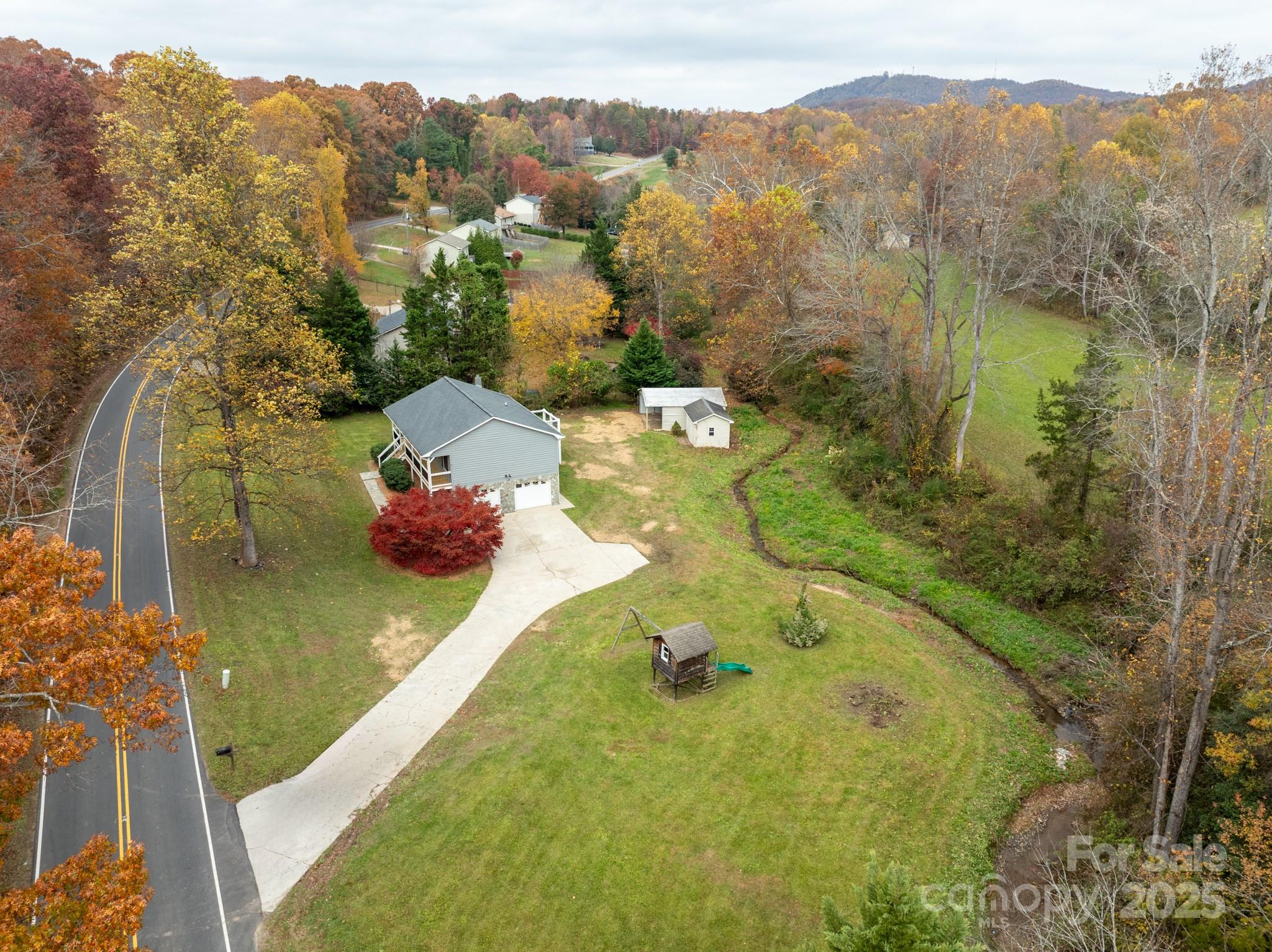 2830 Ellerwood Road Hudson, NC 28638 - Photo 5 of 46 a view of a lake with a mountain