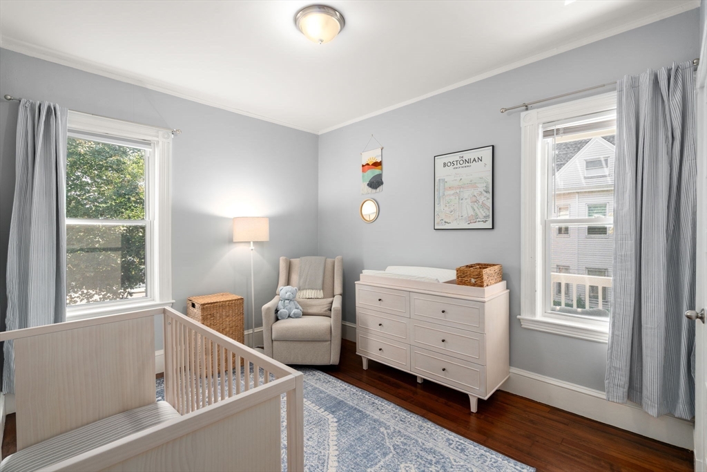 103 Dix Street, Unit 2 Boston, MA 02122 - Photo 14 of 23 a room with a baby bed and a window