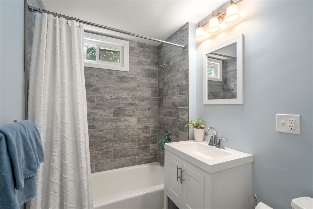 103 Dix Street, Unit 2 Boston, MA 02122 - Photo 15 of 23 a bathroom with a sink a toilet and shower