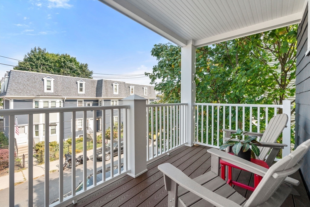 103 Dix Street, Unit 2 Boston, MA 02122 - Photo 19 of 23 a view of a balcony with wooden floor