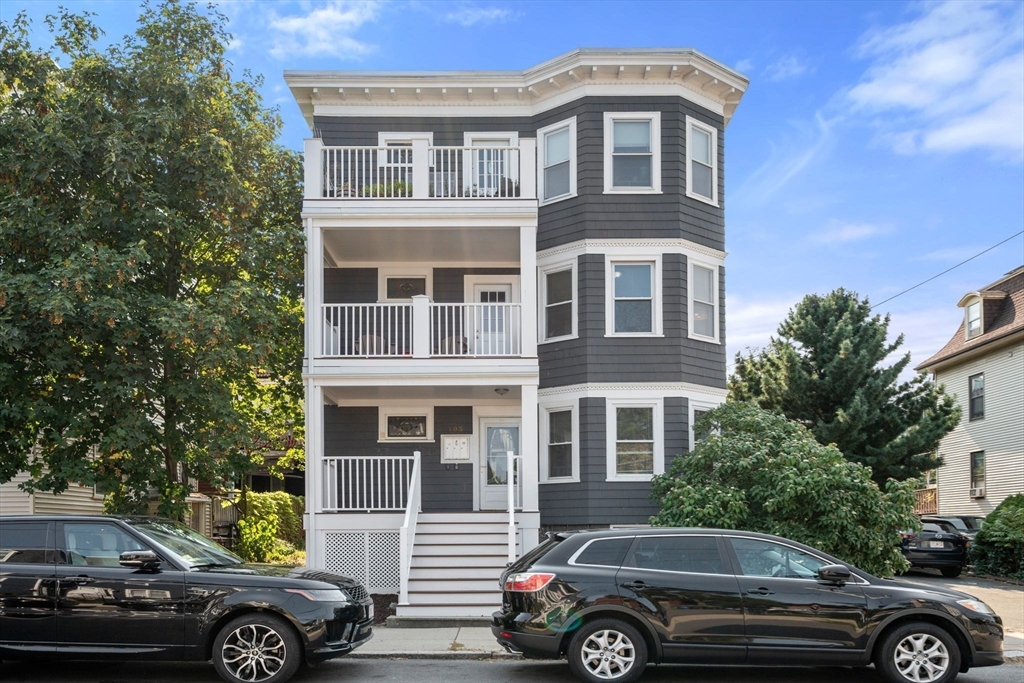 103 Dix Street, Unit 2 Boston, MA 02122 - Photo 20 of 23 a front view of a house with parking area