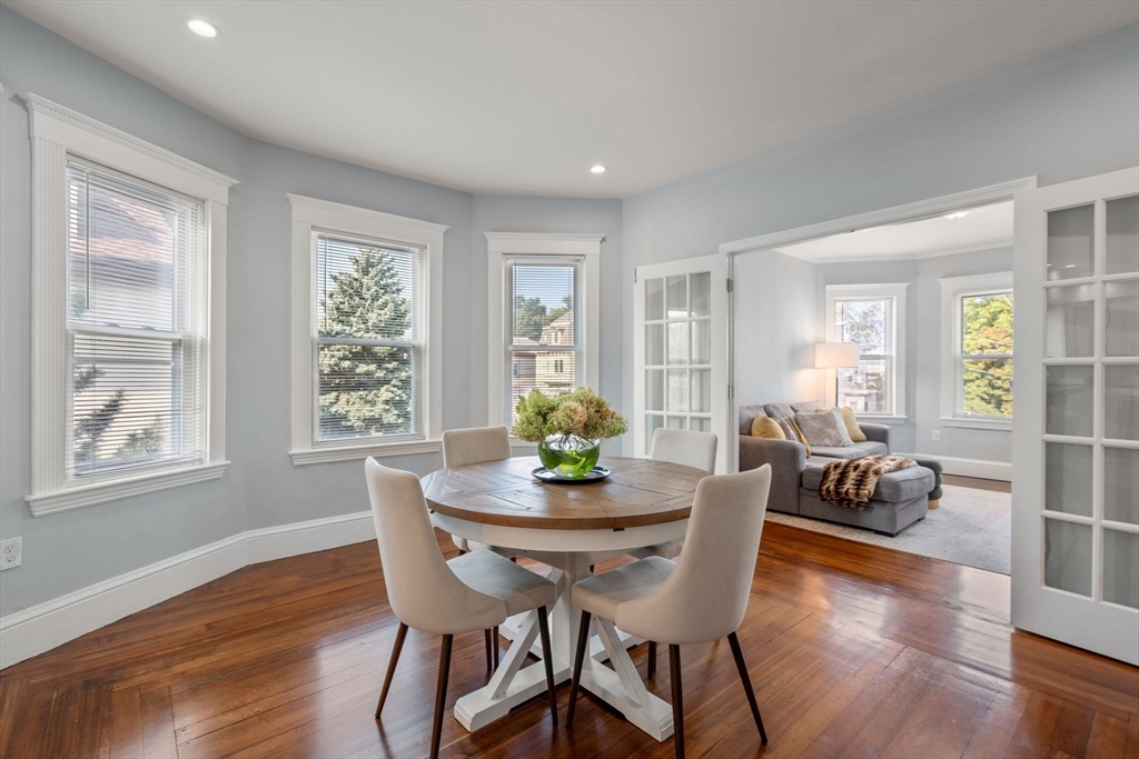 103 Dix Street, Unit 2 Boston, MA 02122 - Photo 3 of 23 a dining room with furniture and wooden floor