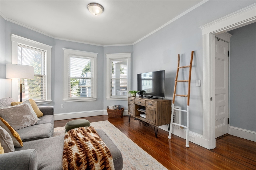 103 Dix Street, Unit 2 Boston, MA 02122 - Photo 5 of 23 a living room with furniture and a flat screen tv