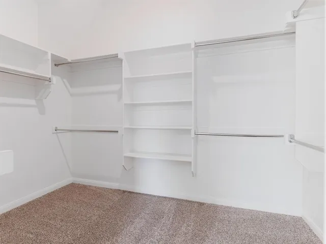 a view of an empty walk in closet