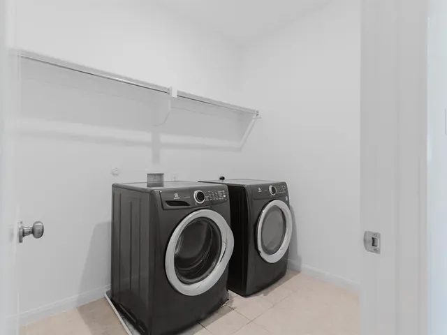 a utility room with dryer and washer