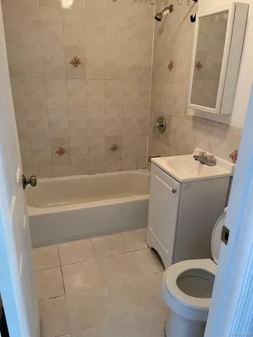 a bathroom with a sink a toilet and a bathtub