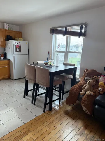 a workspace with furniture window and wooden floor