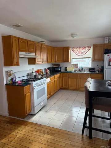 a kitchen with lots of counter top space and a window