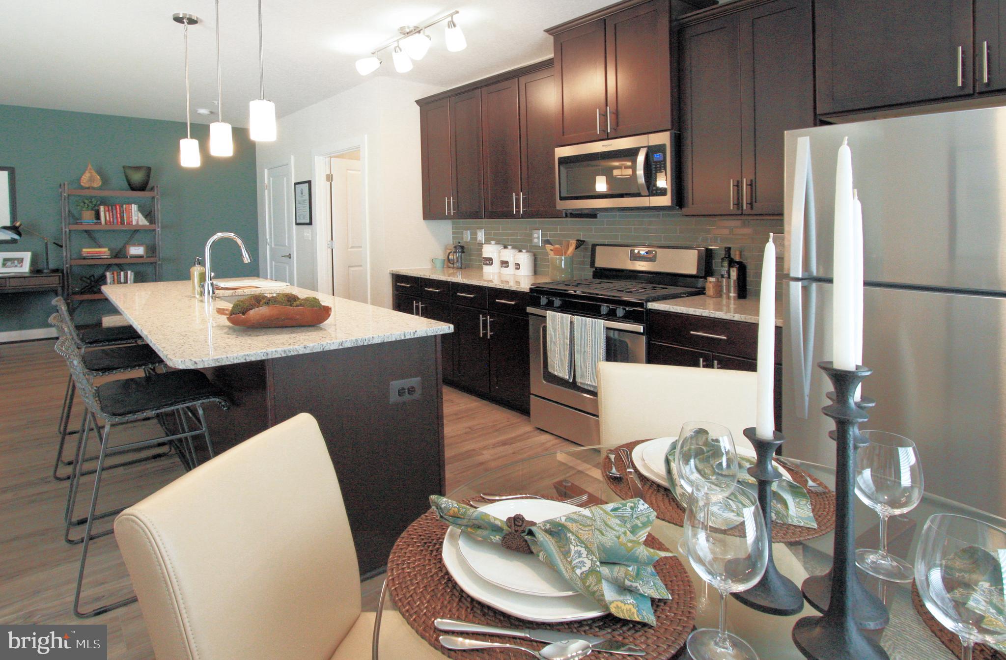 10740 A White Trillium Road, Unit 203 Perry Hall, MD 21128 - Photo 8 of 8 Kitchen features: large island, granite counters