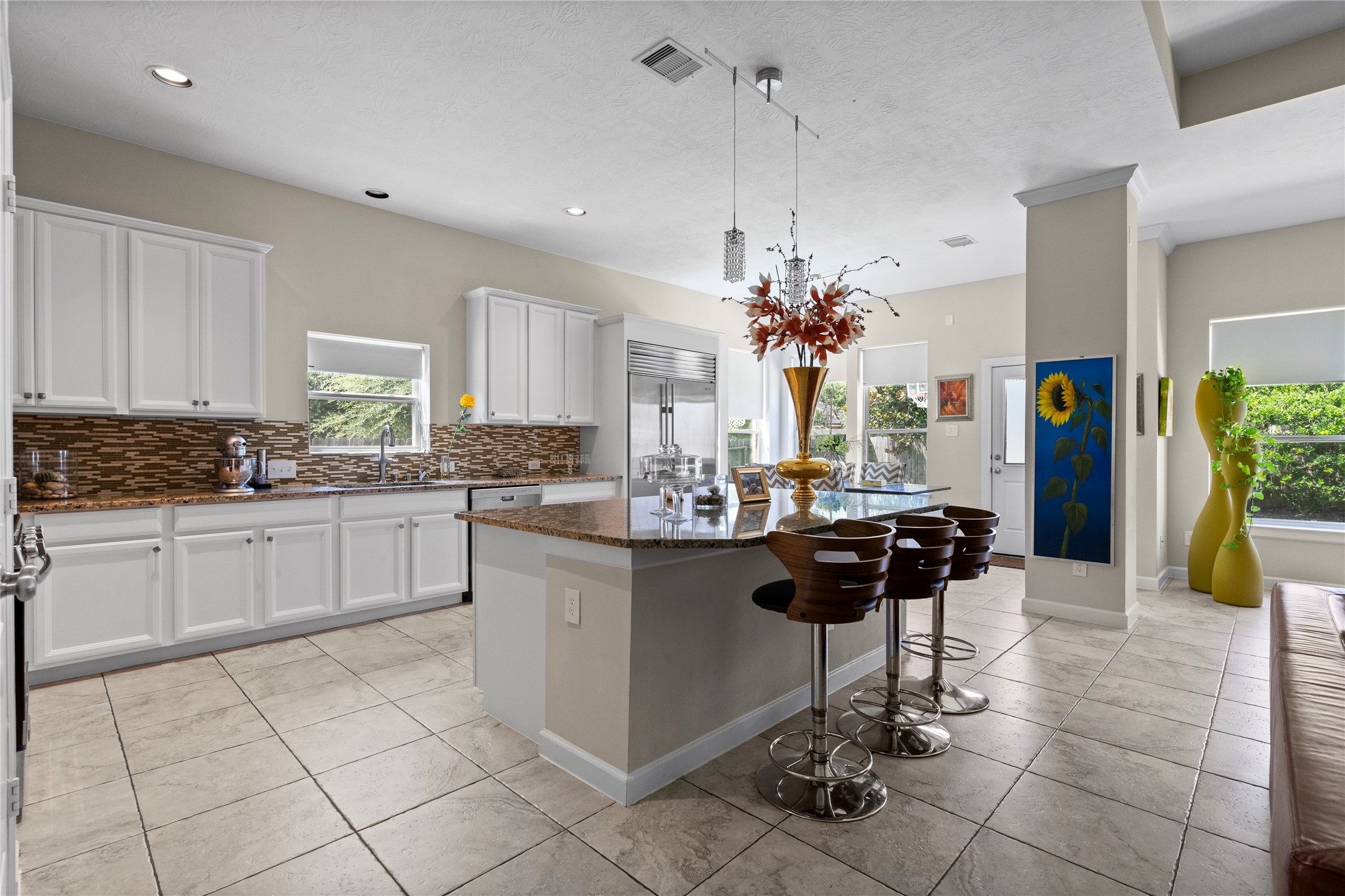 31503 Reston Cliff Court Spring, TX 77386 - Photo 12 of 28 a kitchen with stainless steel appliances granite countertop a stove a sink and a refrigerator