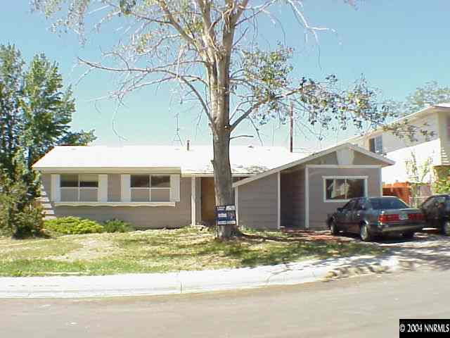 3237 Heights Reno Nv 89503 Reno, NV 89503 - Photo 1 of 1 a front view of a house with a yard and garage