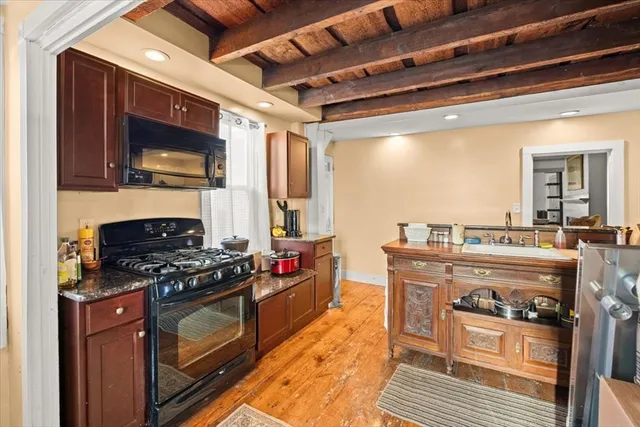 a kitchen with table and chairs