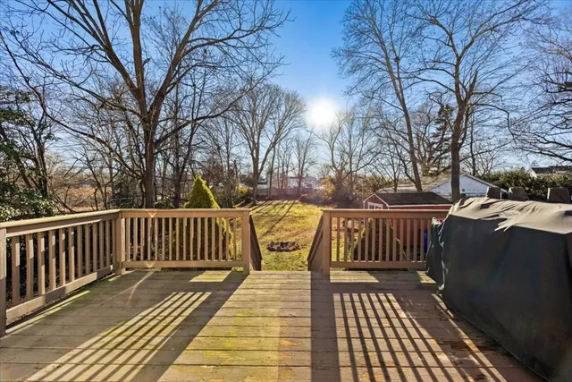 a view of balcony with wooden floor and fence