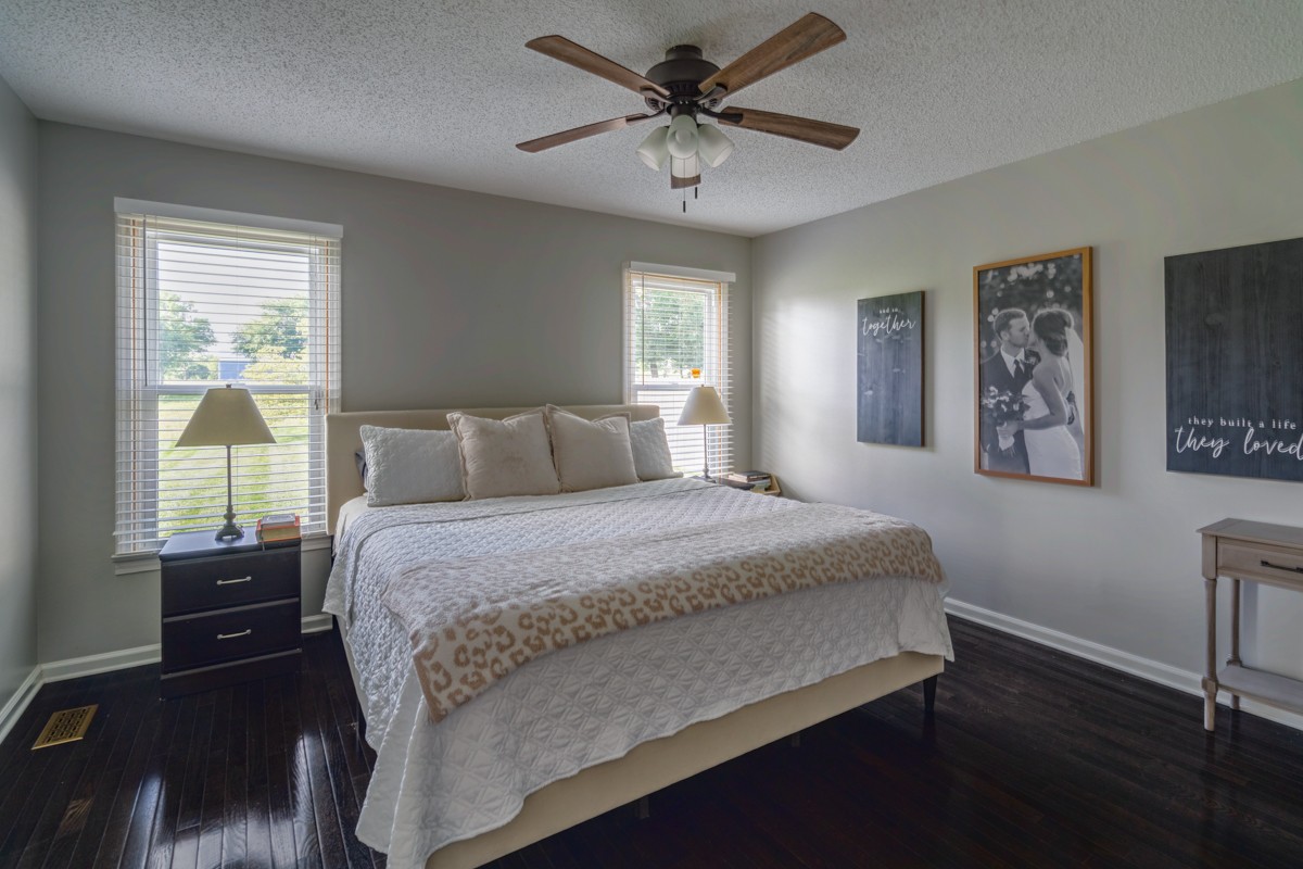 883 South Ridge Trail Clarksville, TN 37043 - Photo 16 of 42 Primary bedroom has lots of space, gorgeous hardwoods and a view to the pastures behind