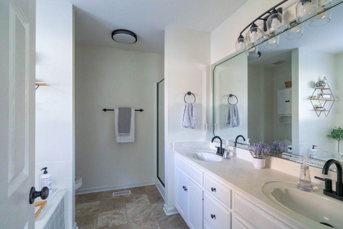 883 South Ridge Trail Clarksville, TN 37043 - Photo 19 of 42 Primary bathroom has double vanities and updated fixtures