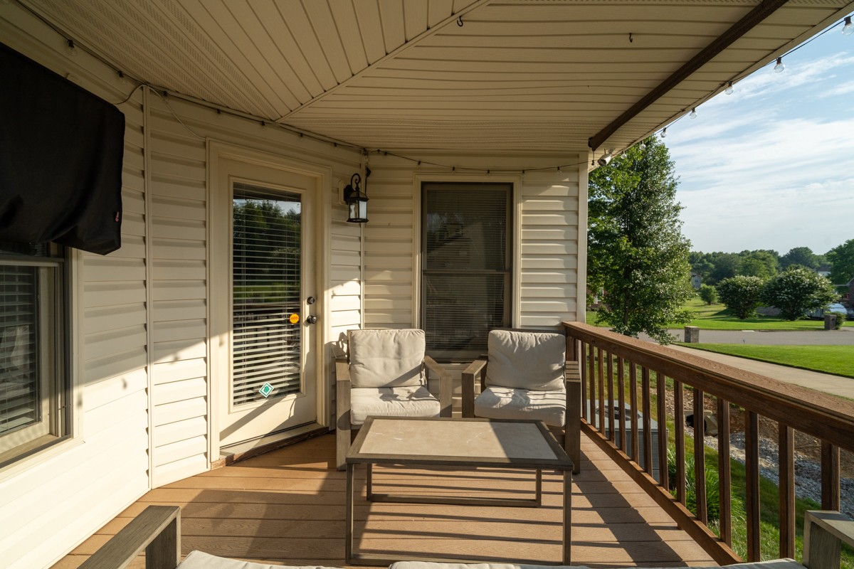 883 South Ridge Trail Clarksville, TN 37043 - Photo 30 of 42 Oh, this covered deck! Can you see yourself relaxing here with a cup of coffee in the morning? Or in the evening, looking over the incredible lawn and the pastures behind you?